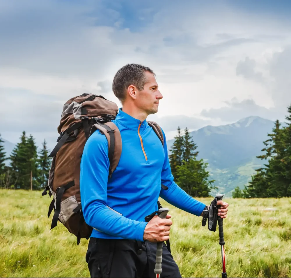 Middle aged male backpacker in Alpine mountains