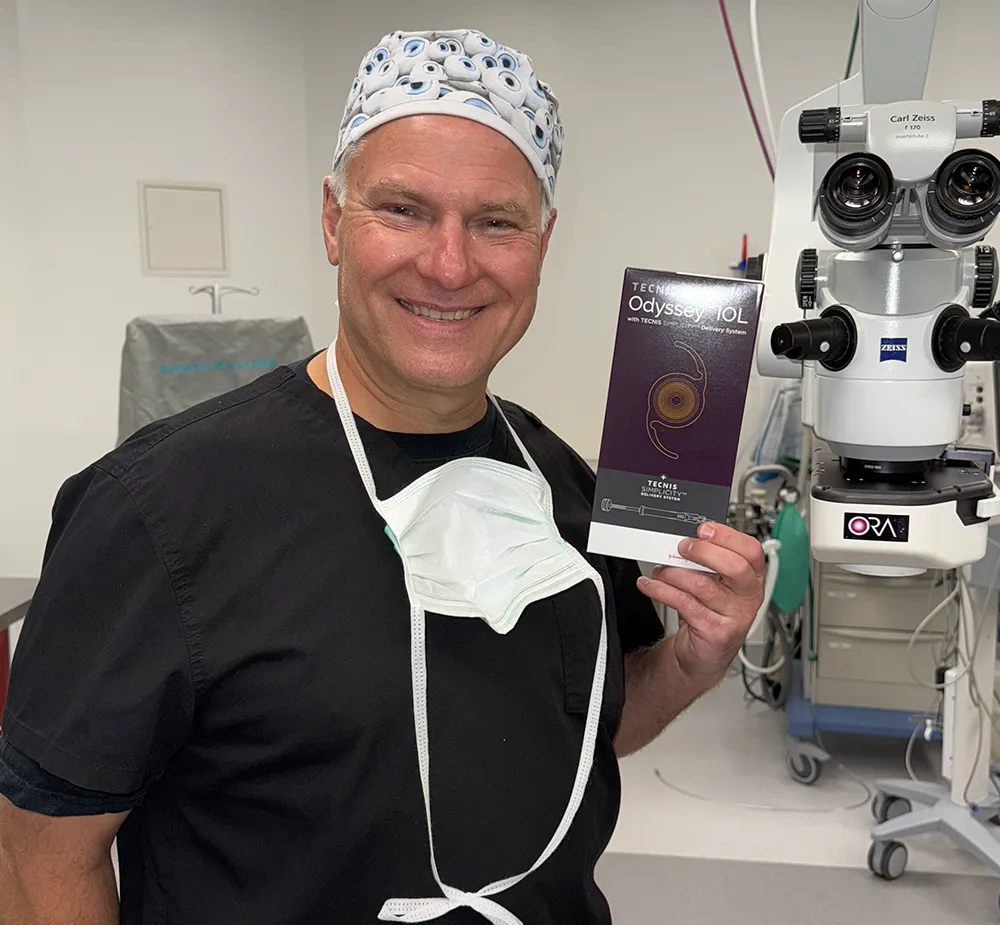 Dr. Kovach holding an odyssey IOL product