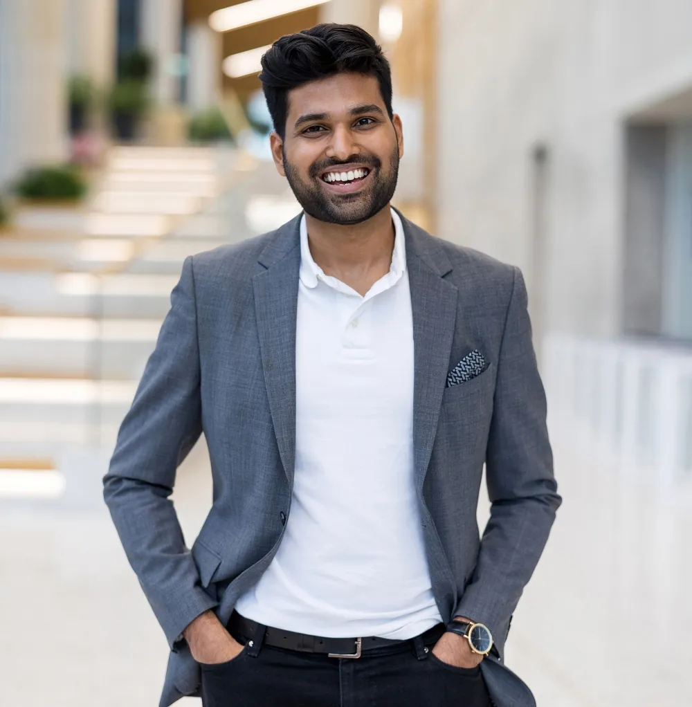 Happy man in business casual after eye surgery