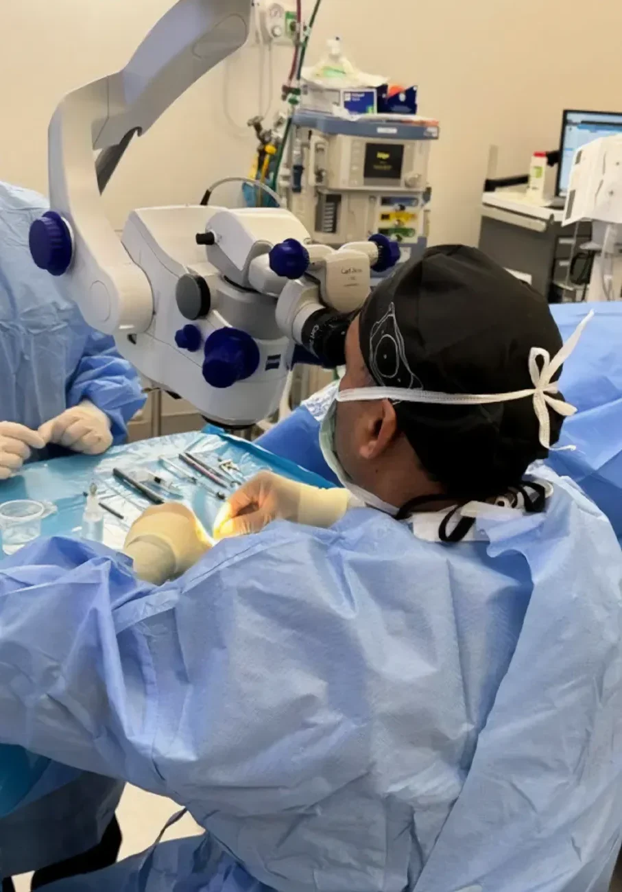 Dr. Mateen performing eye surgery