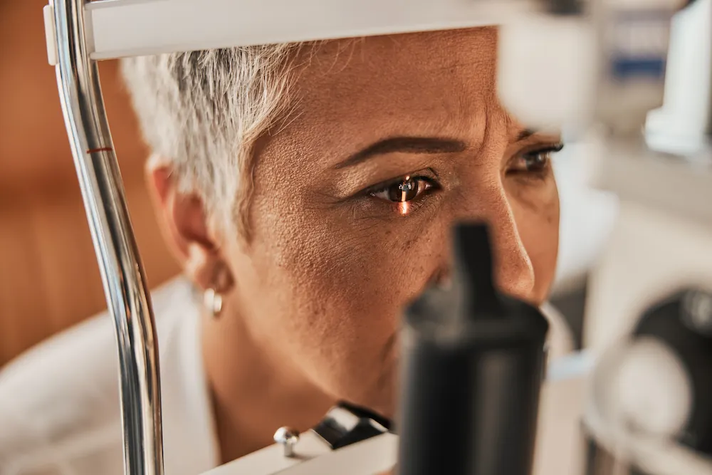 older african american woman getting an eye exam